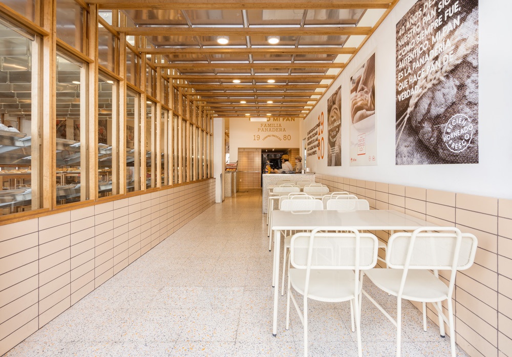 White chairs and tables in a hallway