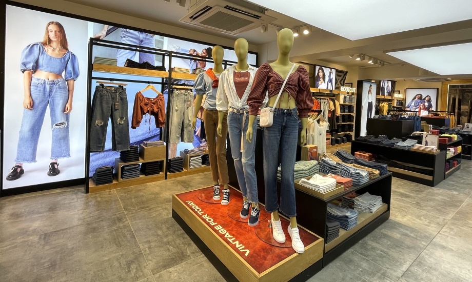 Inside view of a Levis store with different clothes...