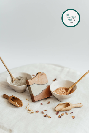 Handmade soap between two small white bowls