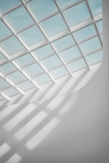 Bright sunlight shines through a white skylight
