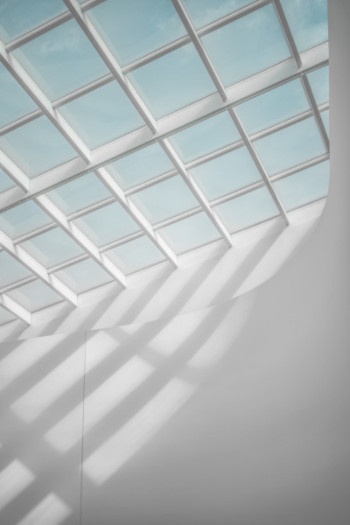 Bright sunlight shines through a white skylight