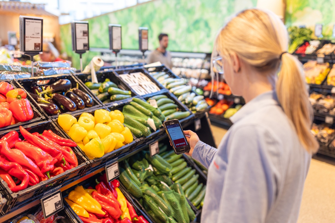 Woman scans vegetables