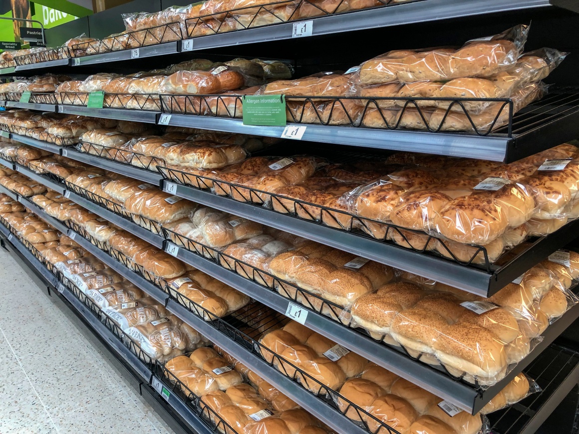 A shelf filled with baked goods.