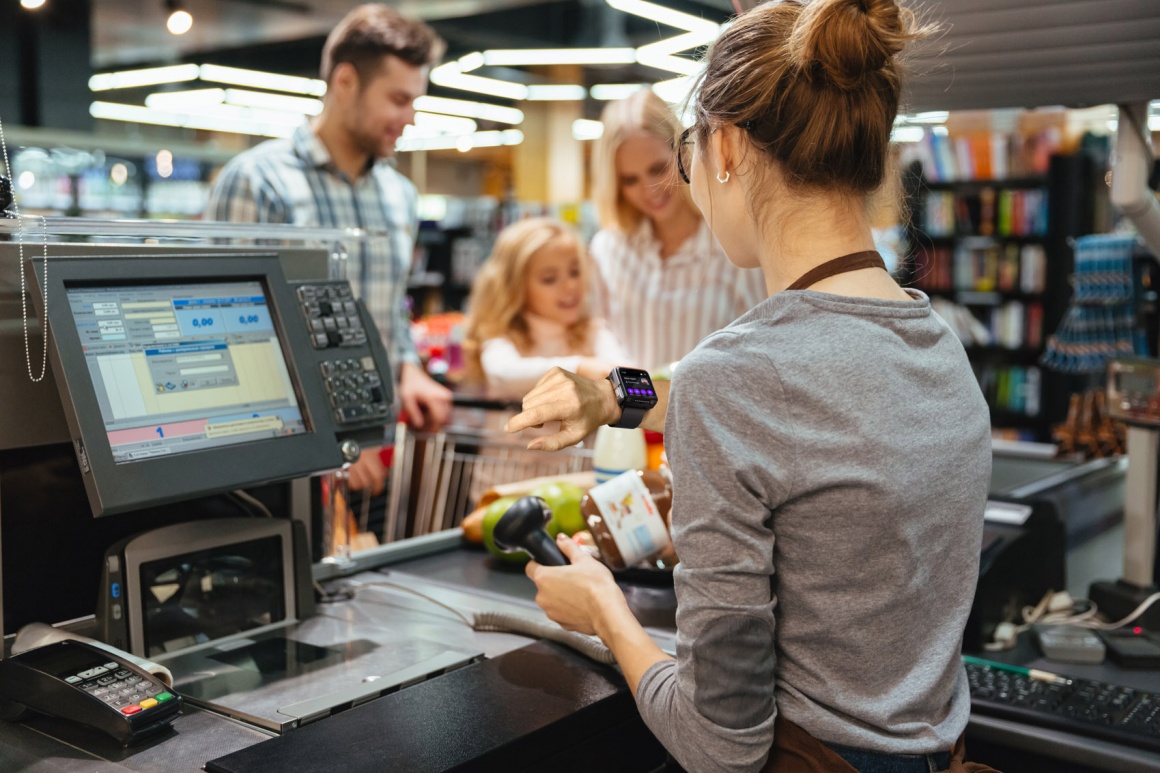 An employee during a checkout process