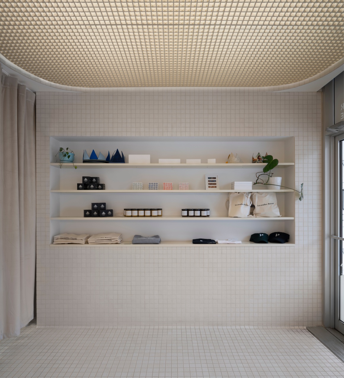 A recessed shelf with various items.