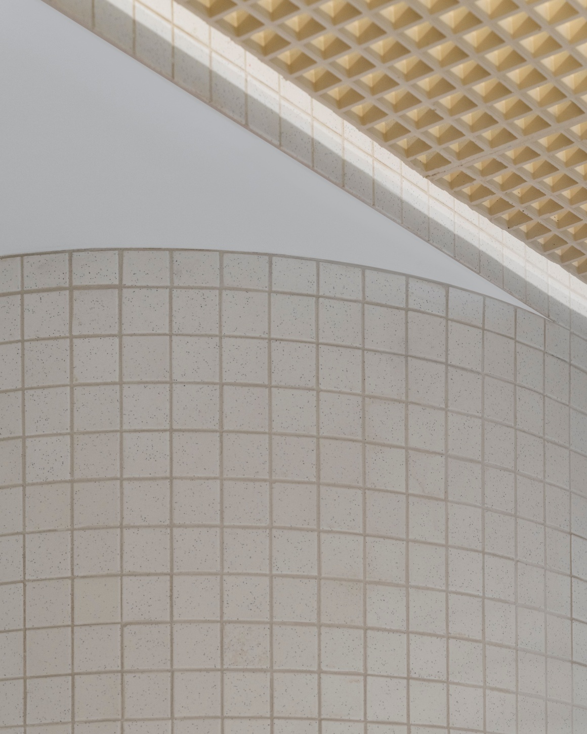 White tiles on a wall.
