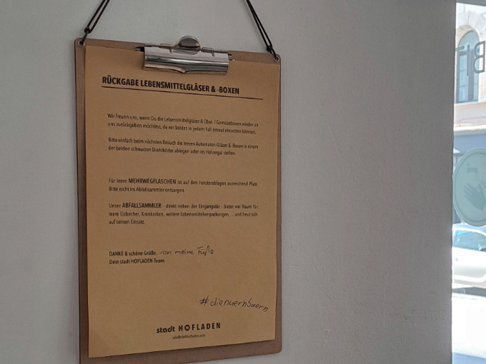 A clipboard with information for the return of containers...