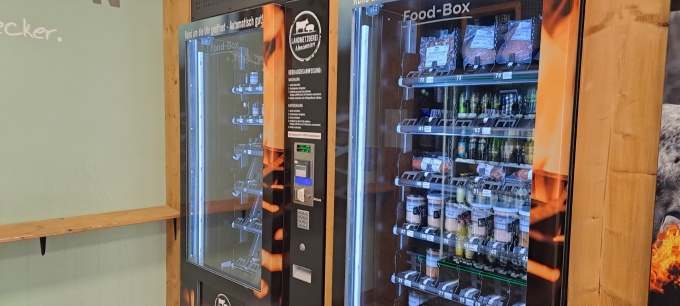 Two vending machines where you can buy meat and sausage products....