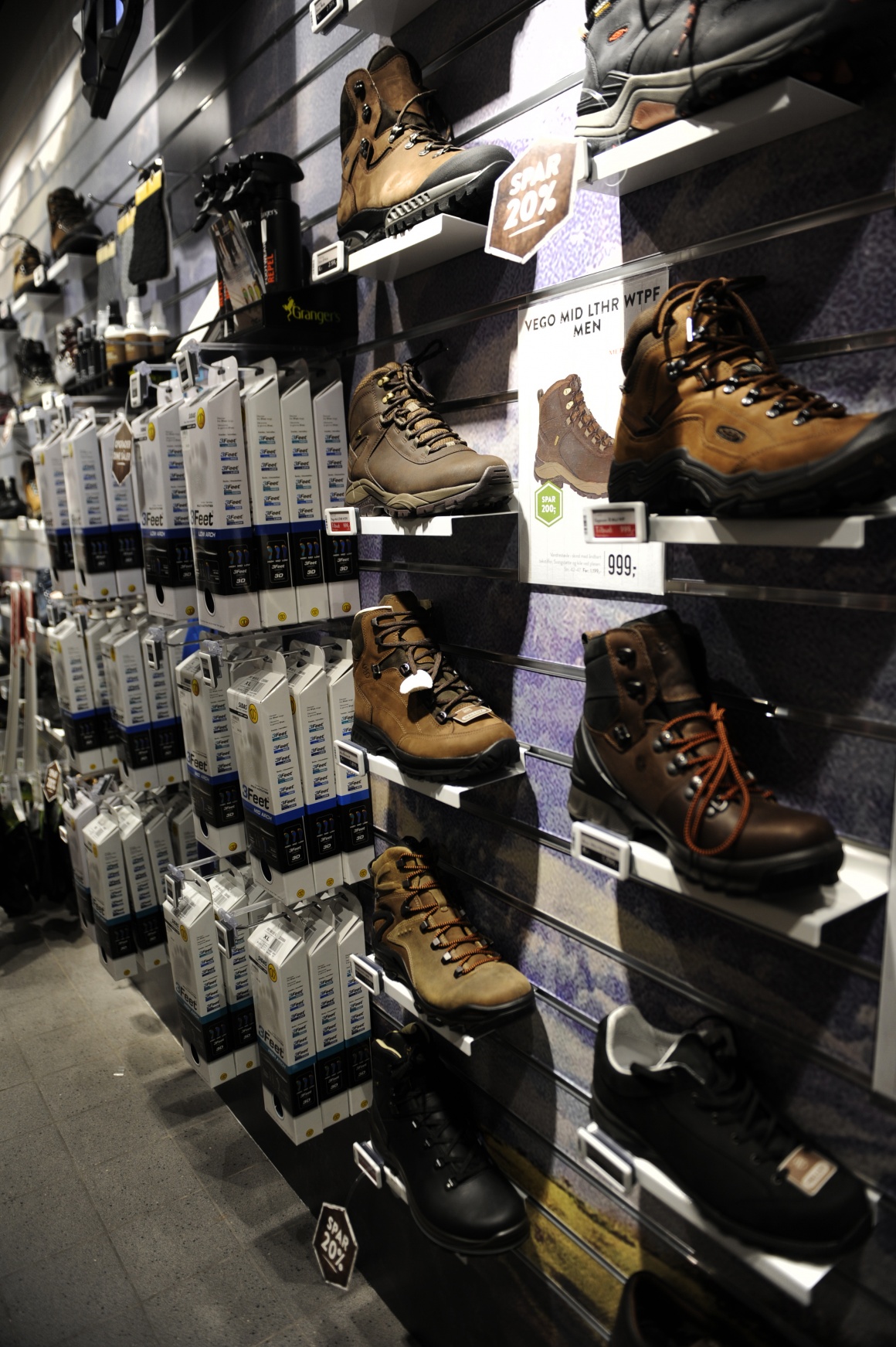 Photo: Electronic shelf labels in clothing store at a shelf with shoes;...