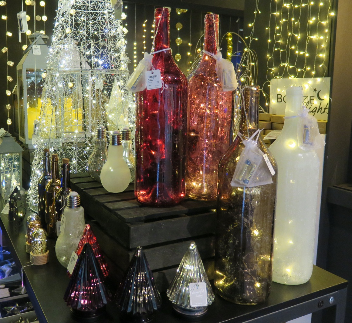 Bottles and vases with glowing lights inside; copyright: iXtenso / Pott...