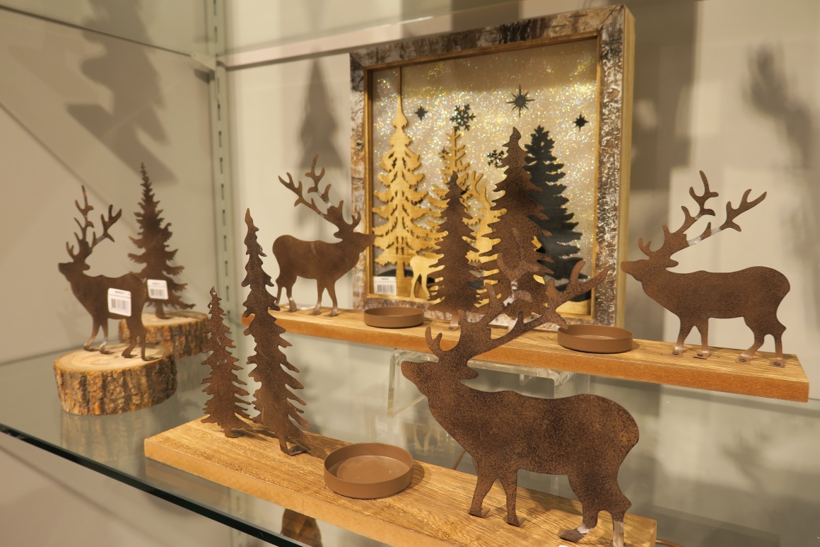 Christmas decoration elements made of wood and artificially rusted metal;...
