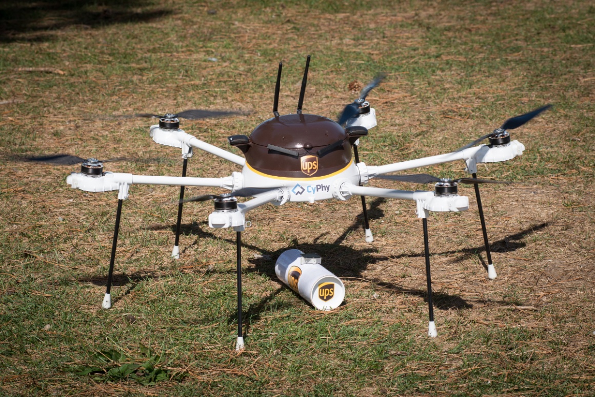 A delivery drone in UPS branding standing on grass; copyright: UPS...