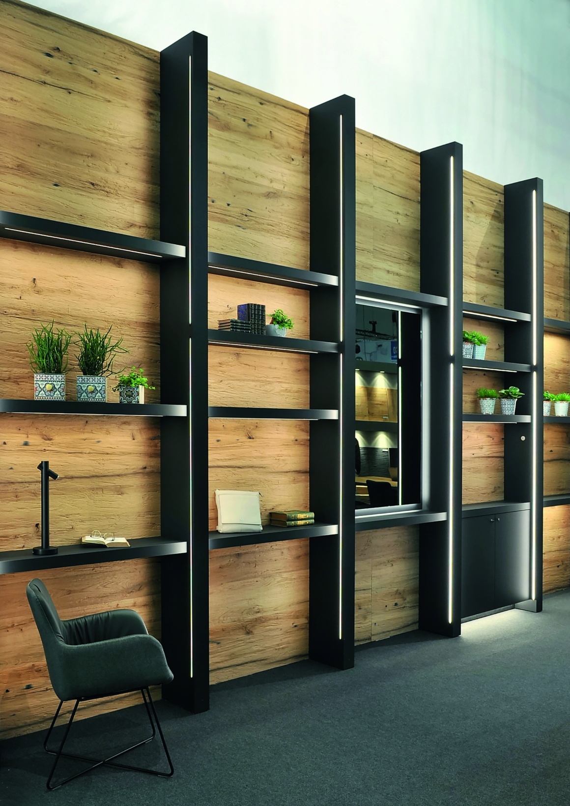 Shelf with light-coloured wall and dark wooden sides...