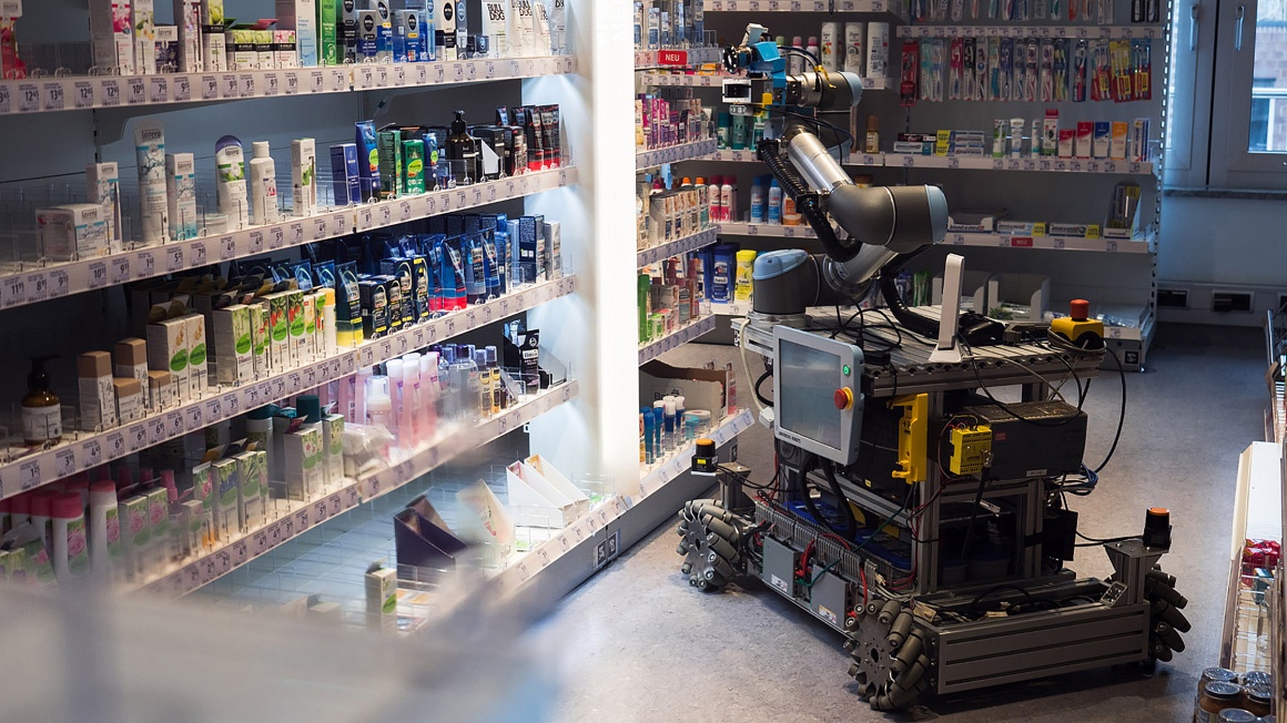 A robot between shelves at a drugstore