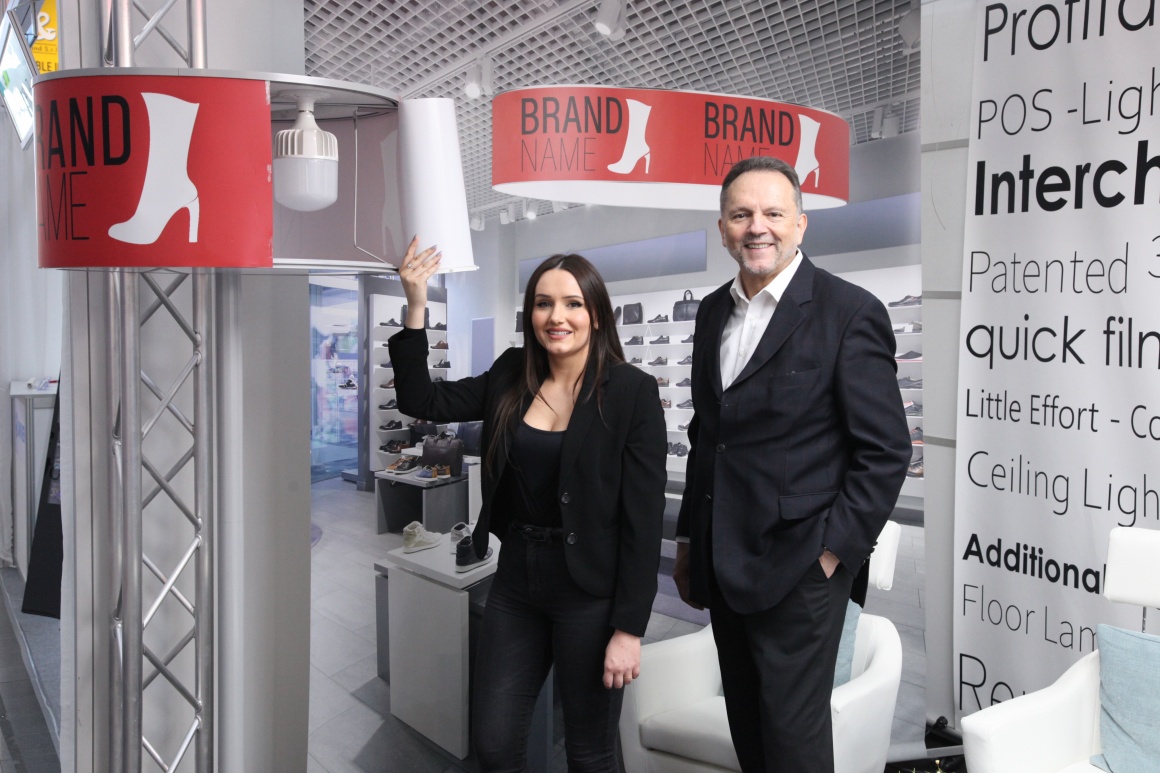 A man and a woman at a booth