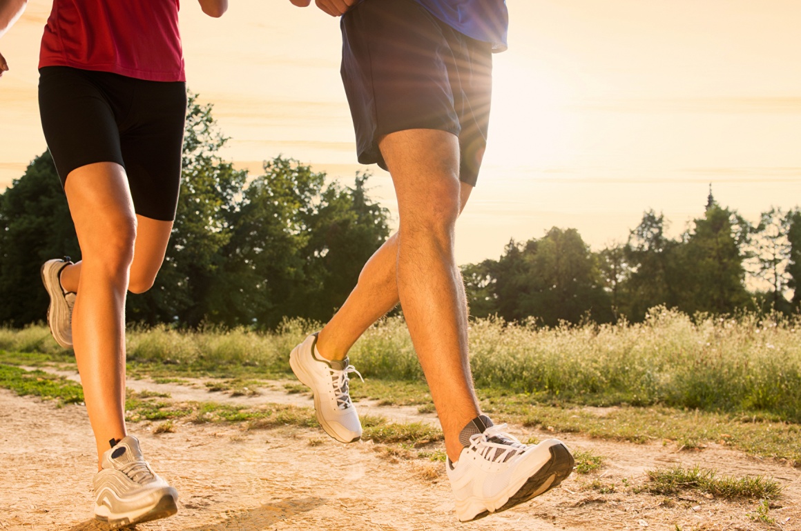 Two people jogging in the dusk