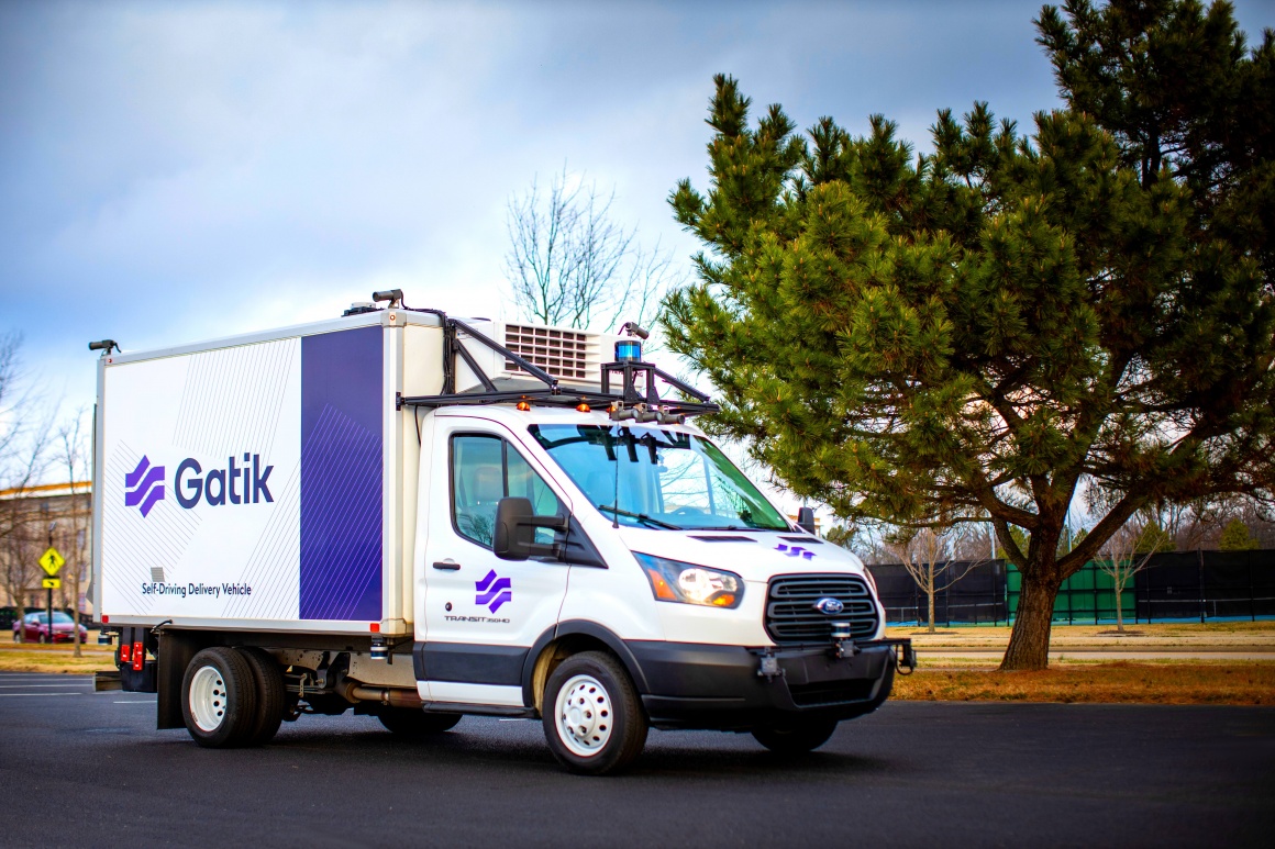 A box truck with a camera mounted on top at the front for self-driving...