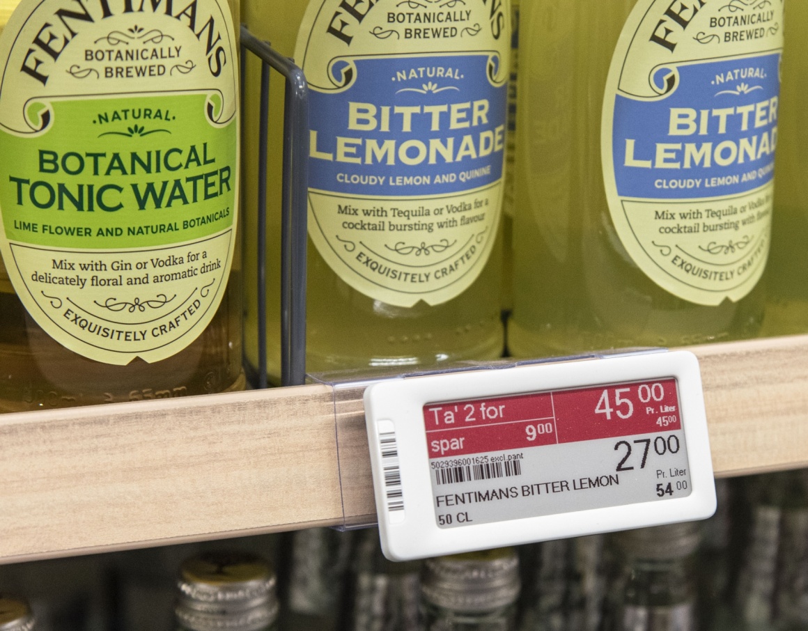 Close up of a shelf in a grocery store with an electronic shelf label...