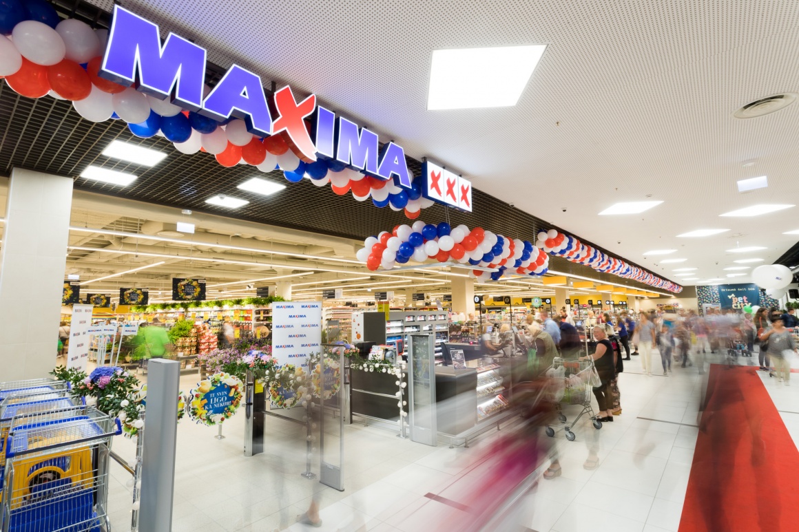 Checkout area of a supermarket branch with customers...