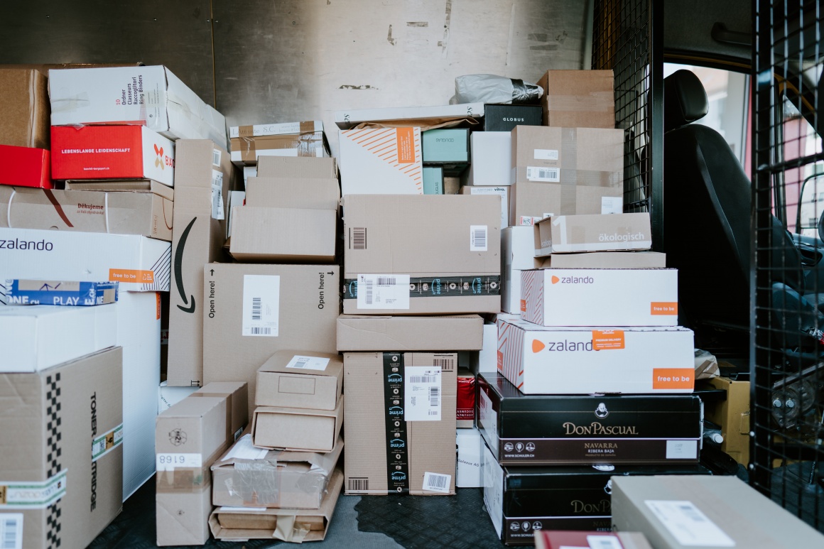 The inside of a delivery van with many different packages...