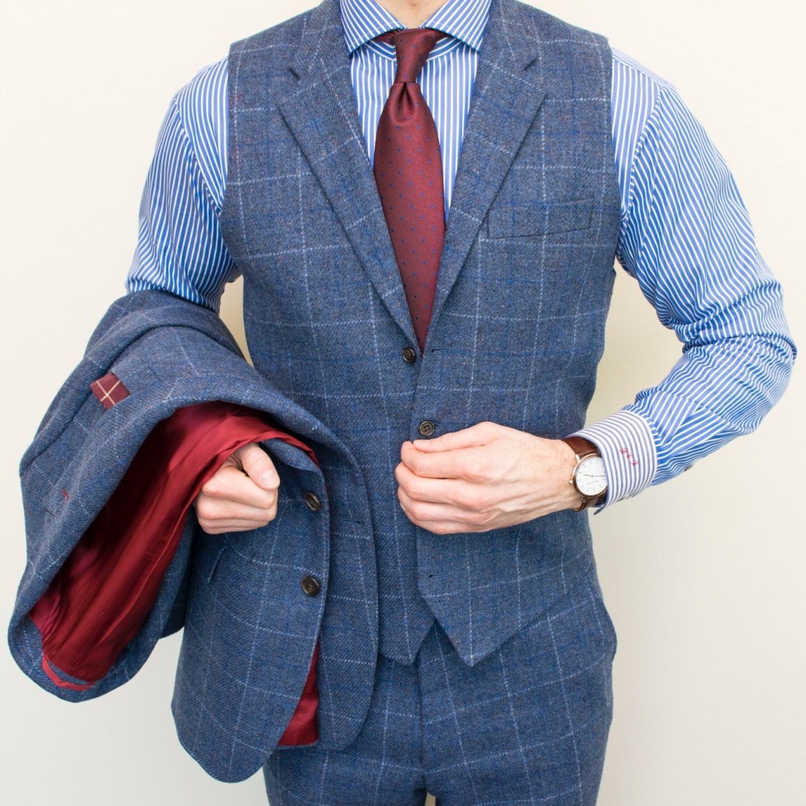 A man wearing a tailored suit with a waistcoat