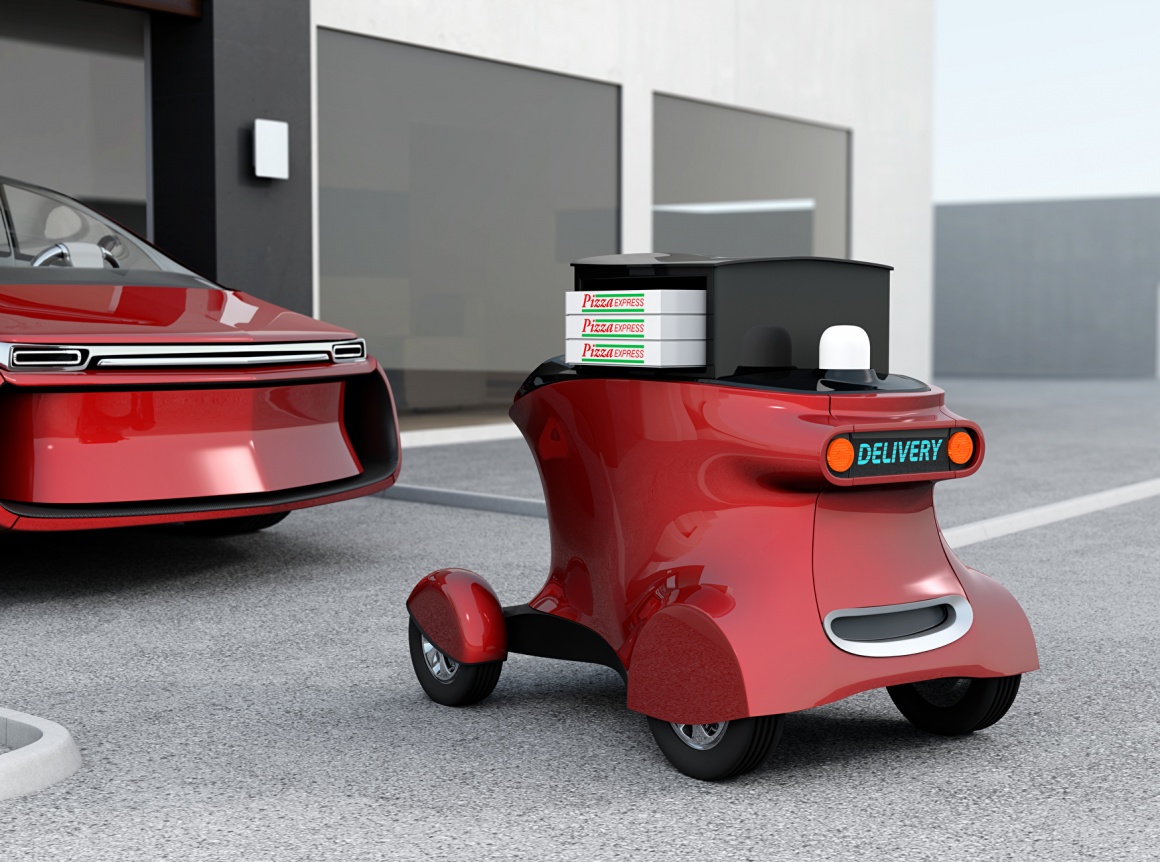 A red self driving delivery robot with pizza packages...