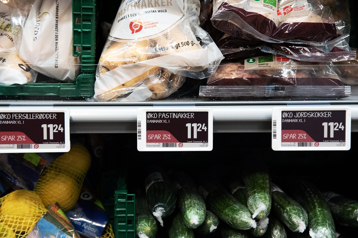 Shows a store shelf full of fresh produce and an electronic shelf label...