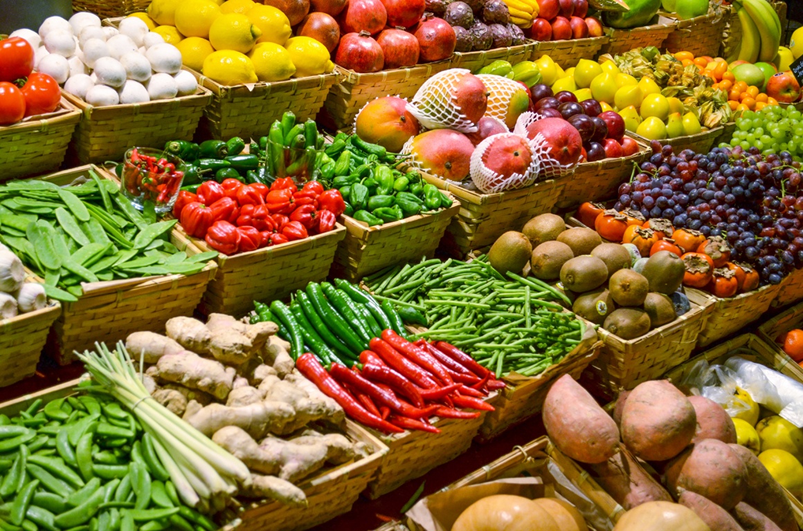 Many different fresh foods in individual baskets next to each other...