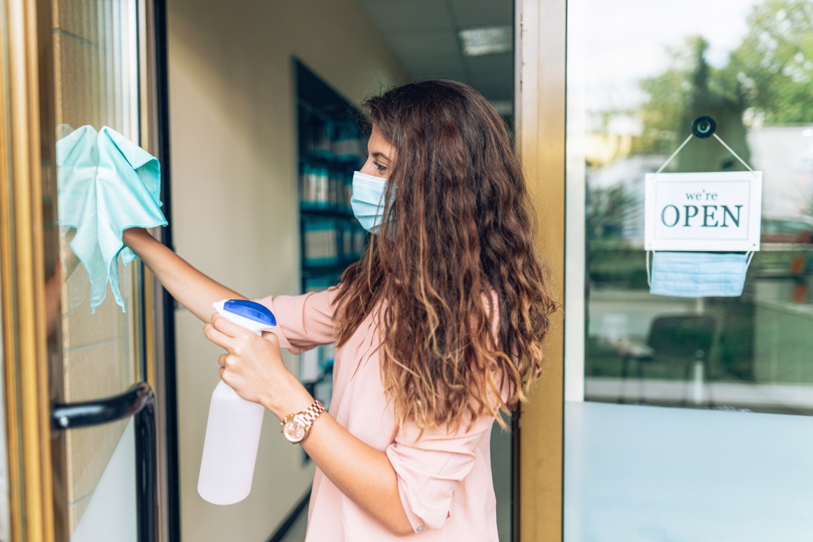 Small business preparing to reopen after the Covid-19 quarantine, disinfecting...